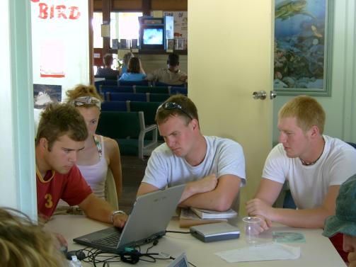 Four students working at computer