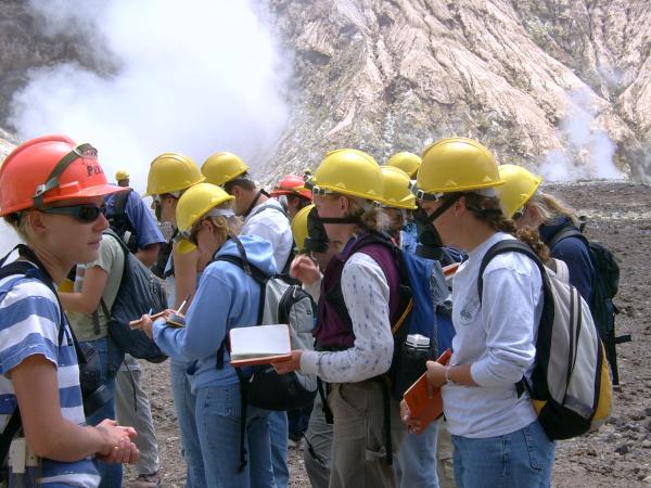  Hard-hatted students taking notes