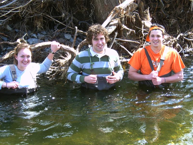 3 students in chest-high water